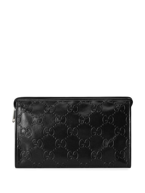 gucci embossed clutch bag.